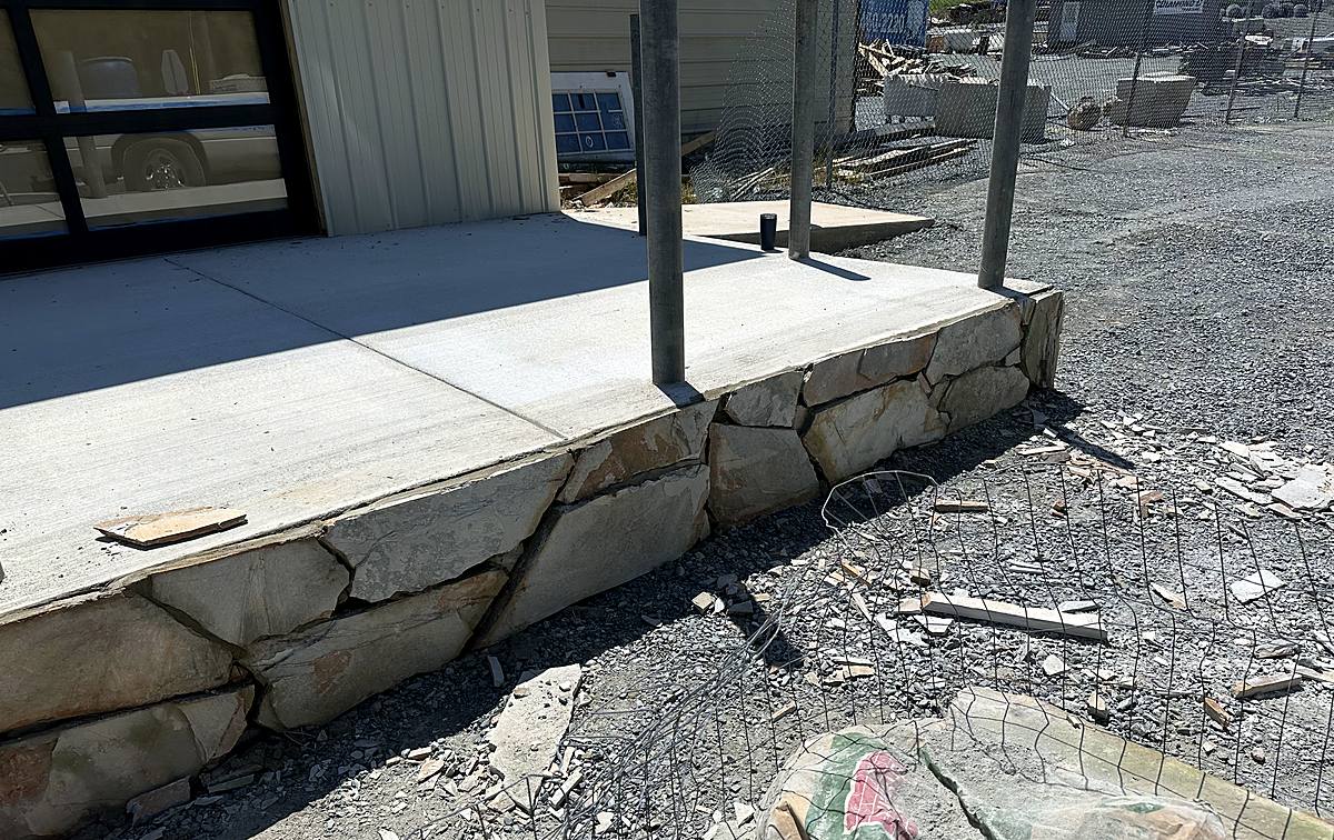 Stone wall and concrete slab